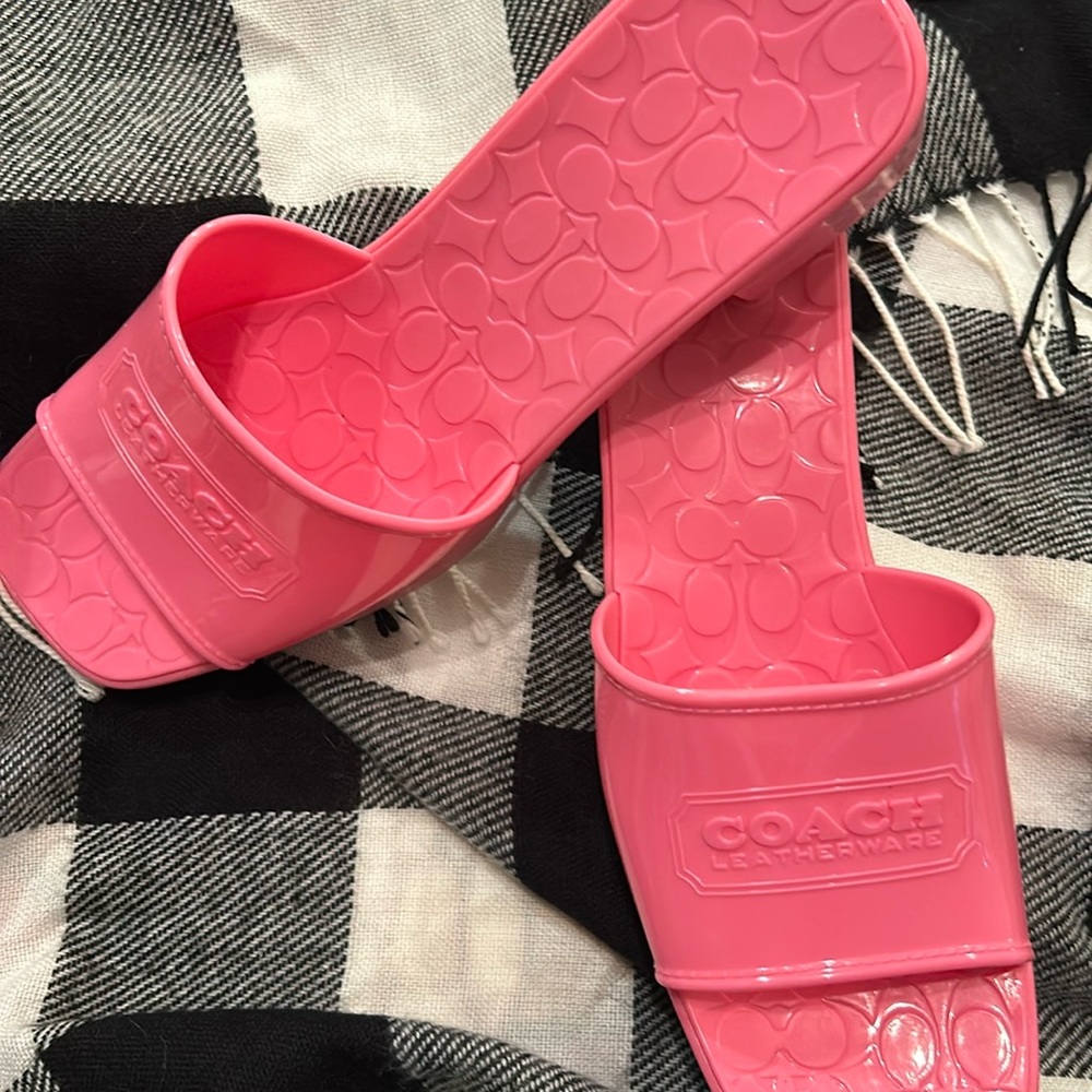 New with box Coach Scarlett Rubber slip-ons in Petunia Pink. Size 10B.
